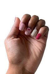 pink nail polish with hearts