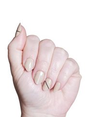 nude nail polish with black stripe