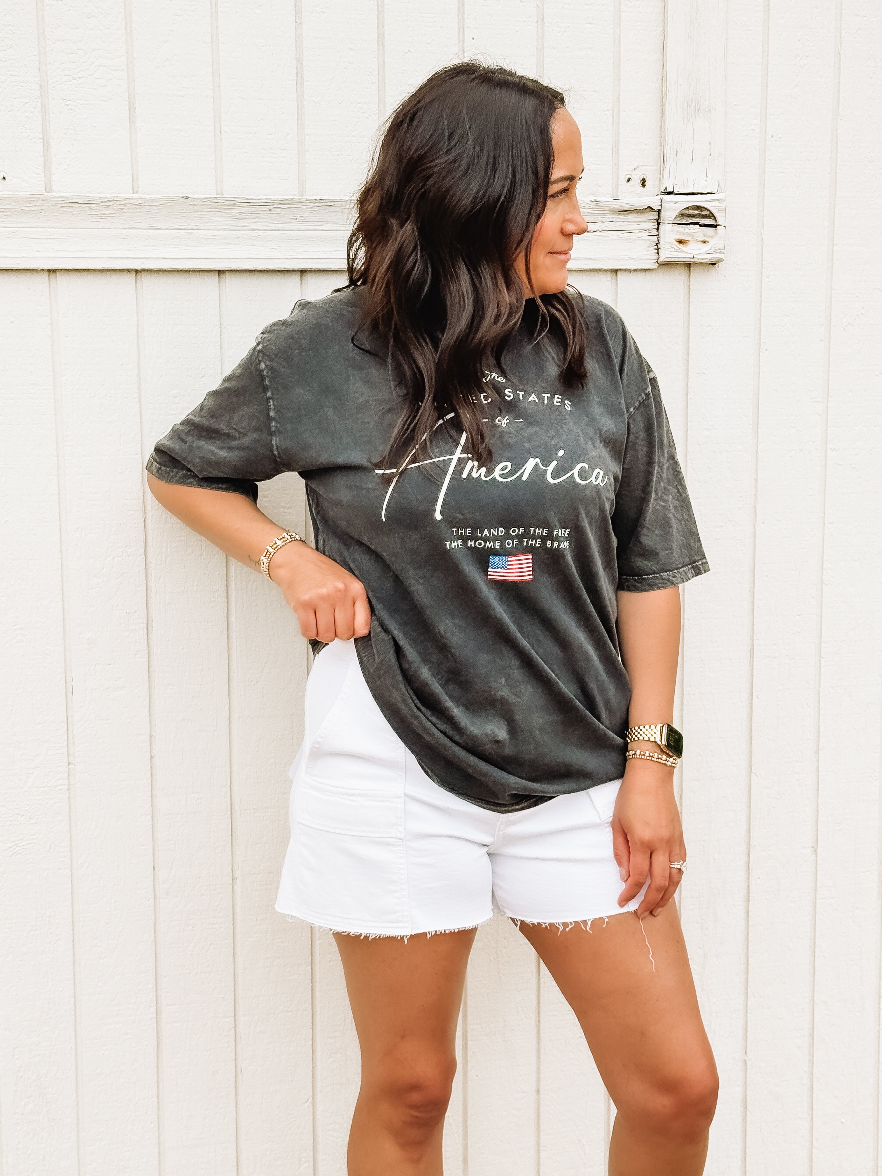 Black acid wash tee with America typography.