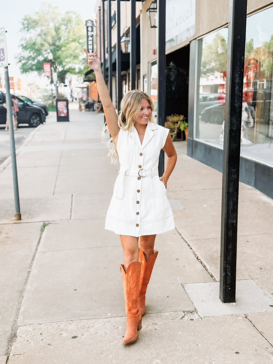 Cream button up sleeveless denim mini dress with d ring belt detail.