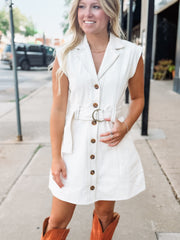 Cream button up sleeveless denim mini dress with d ring belt detail.