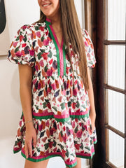Green, Wine, Purple, Pink and Orange floral mini dress with puff sleeves and pink and green contrast seaming.