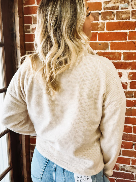 cream pullover with tan detailing