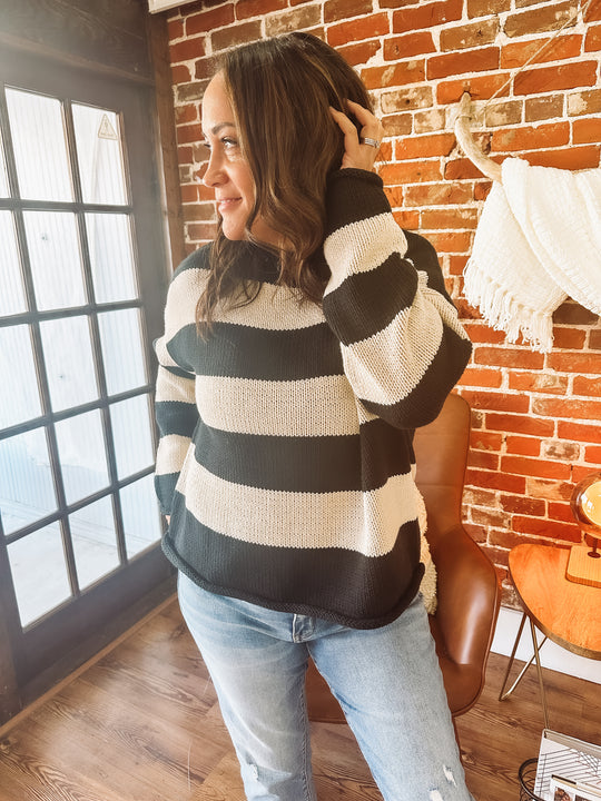 black and cream horizontally striped sweater