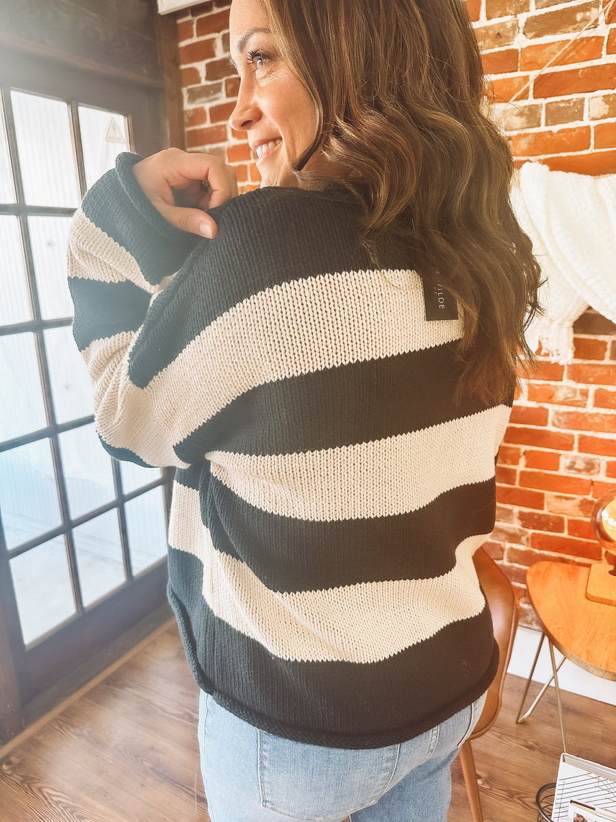 black and cream horizontally striped sweater