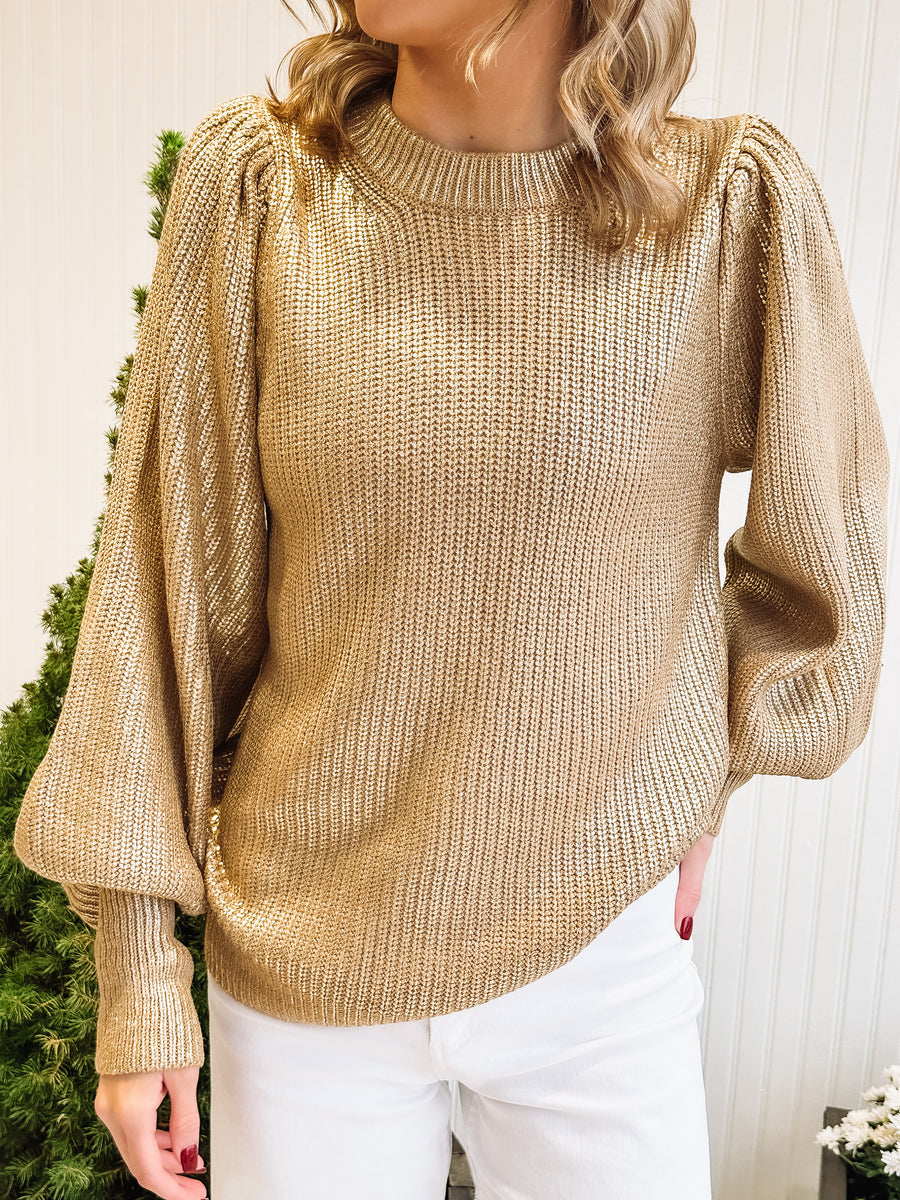 gold sweater