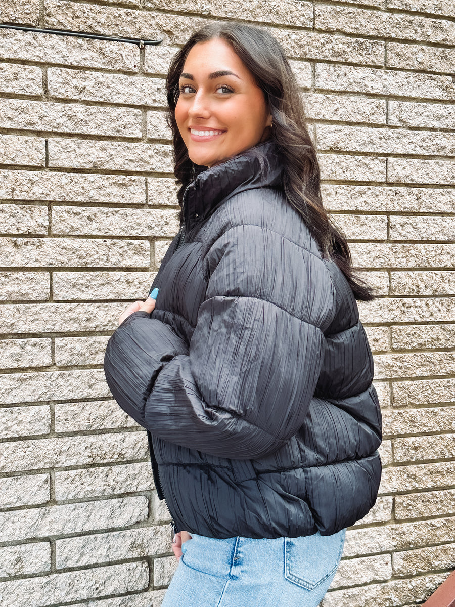 black textured puffer coat