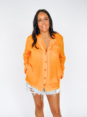 orange long sleeve button up blouse 