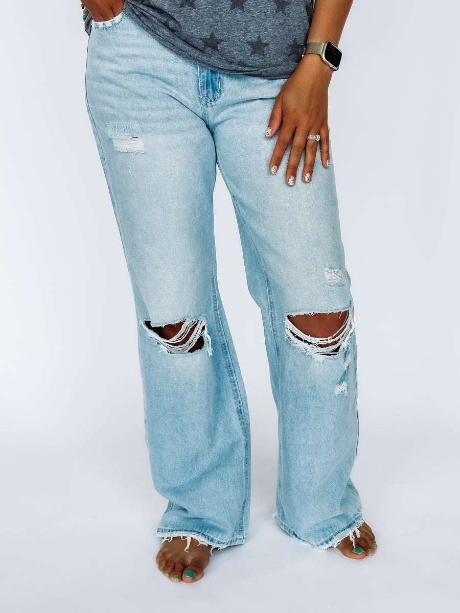 Light wash distressed flare jeans