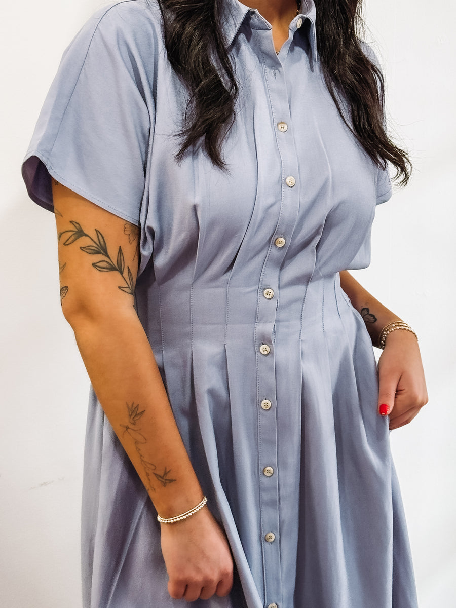 Light blue short sleeve, button up, midi dress.