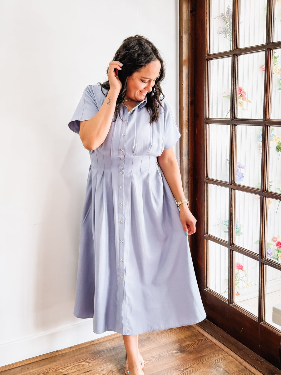 Light blue short sleeve, button up, midi dress.