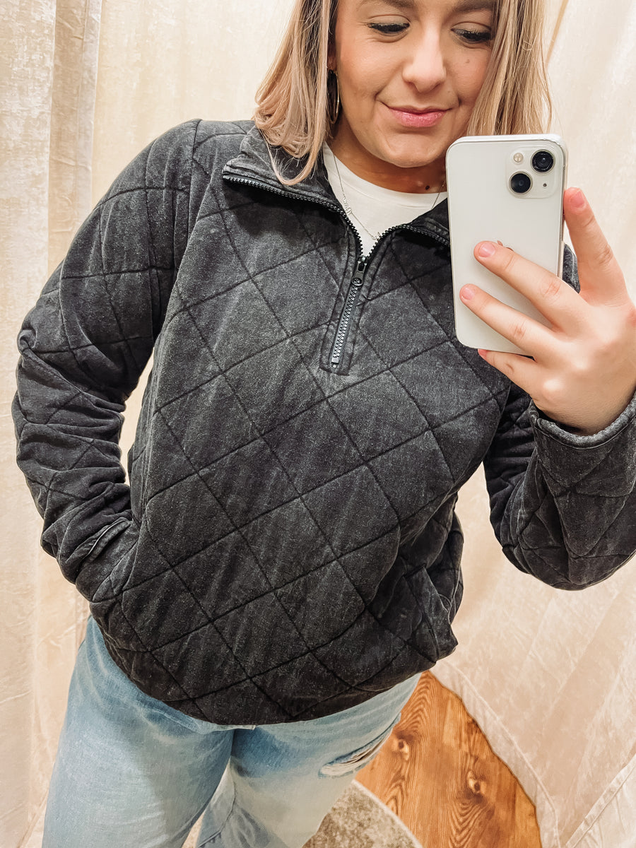 black quilted pullover