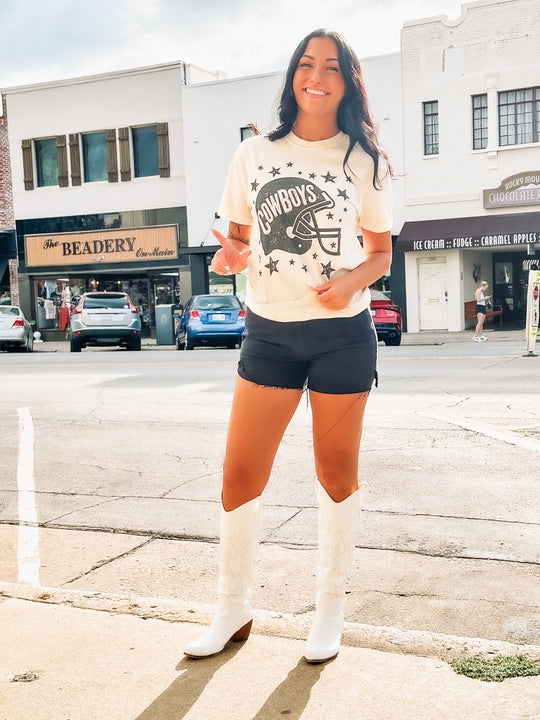 ivory tee with black football helmet featuring "cowboys" typography