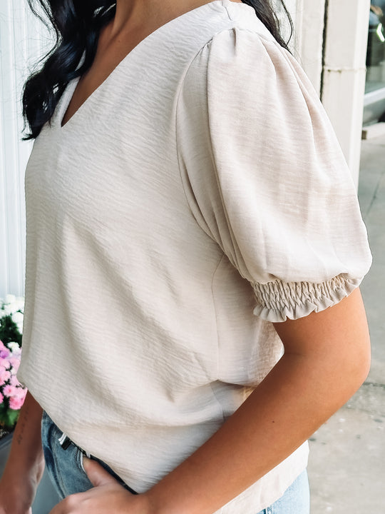 short sleeve cream colored textured blouse