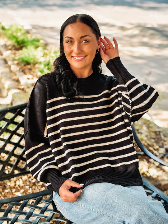 Black and cream horizontally striped sweater