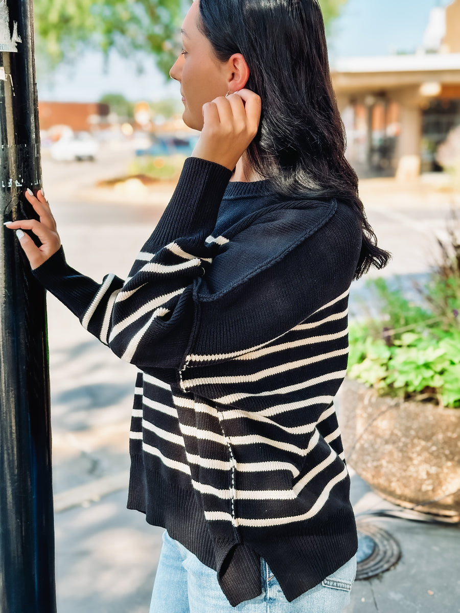 Black and cream horizontally striped sweater