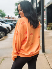 Sherbert orange Oklahoma State long sleeve crew neck with embroidered OSU logo in a slightly darker orange.