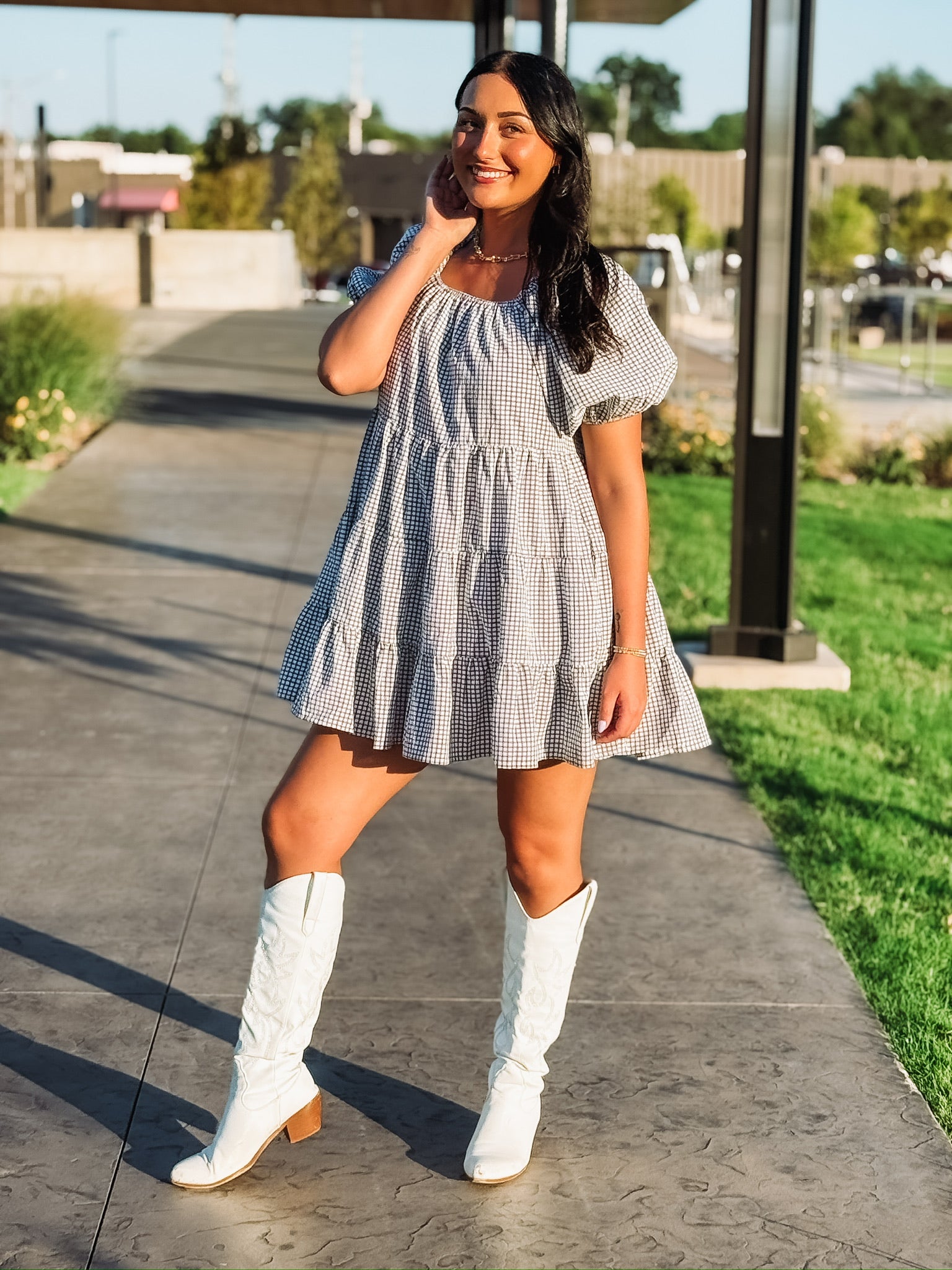 Black and white plaid tiered puff short sleeve mini dress.