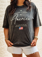 Black acid wash tee with America typography.