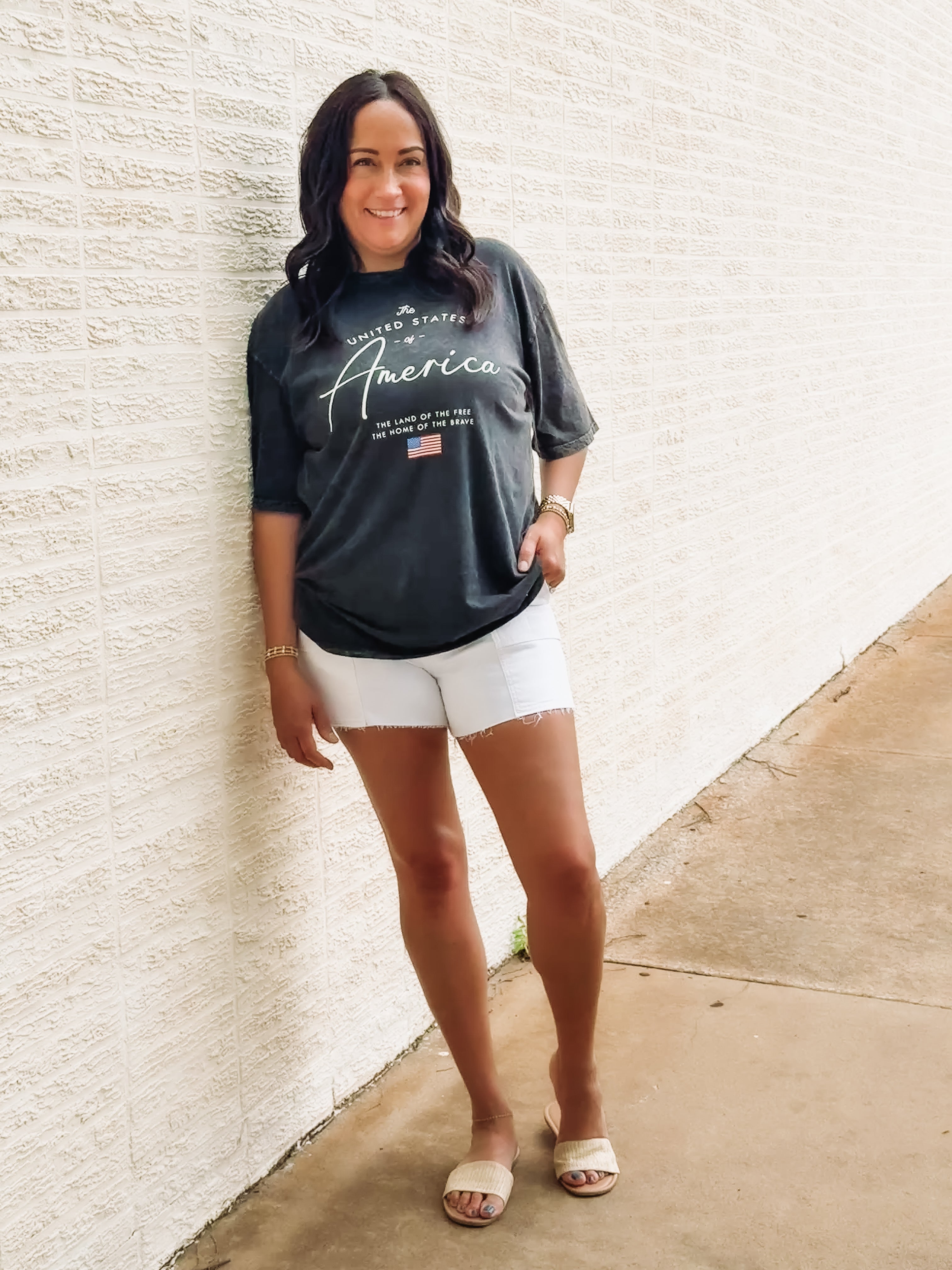 Black acid wash tee with America typography.
