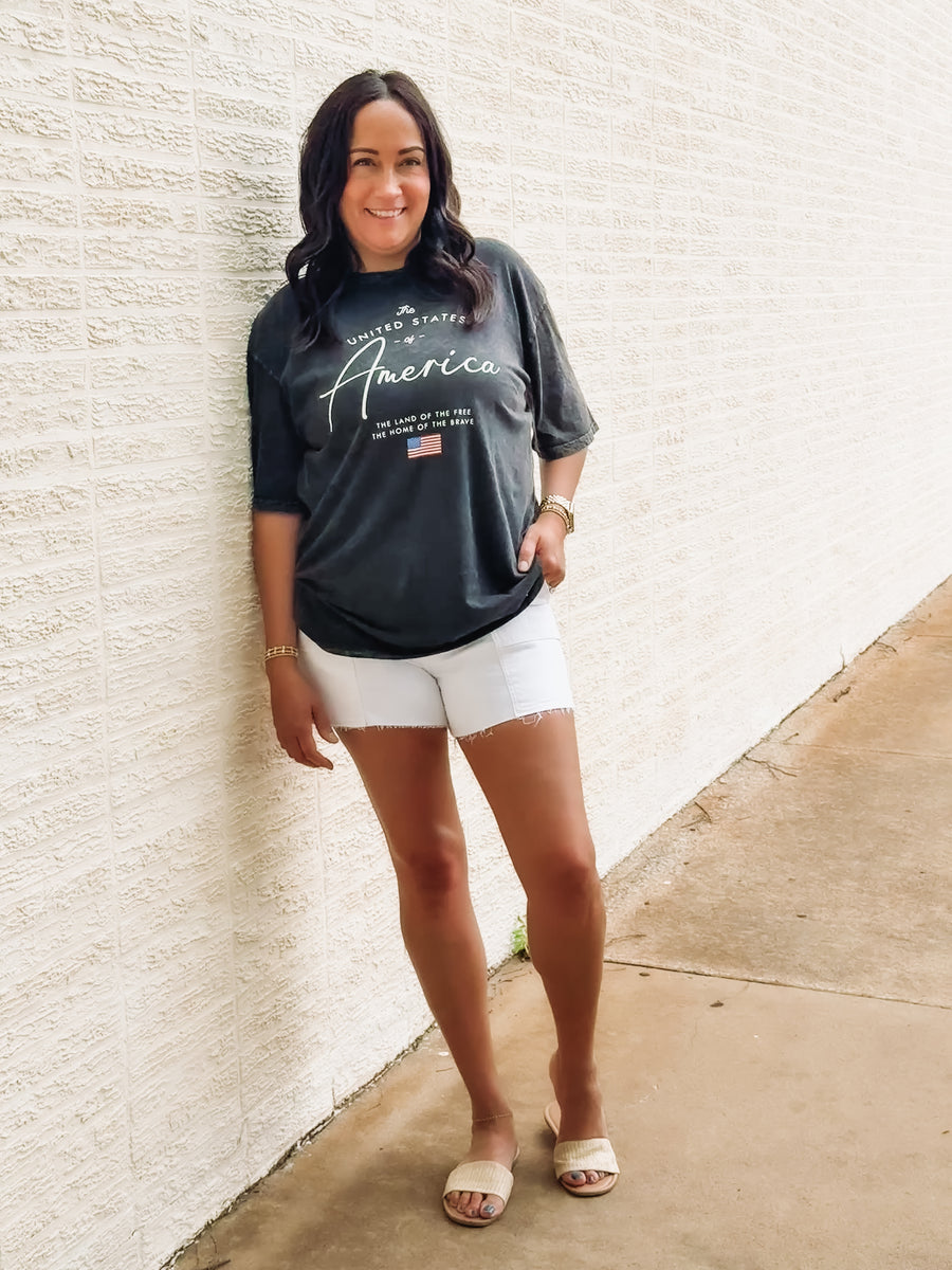 Black acid wash tee with America typography.