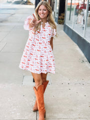 Orange and white OSU-themed toile dress with flutter sleeves, featuring a fitted waist and flowy silhouette.