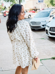  Yellow floral on a cream base long sleeve  tie waist long sleeve mini dress.