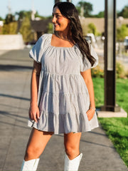 Black and white plaid tiered puff short sleeve mini dress.