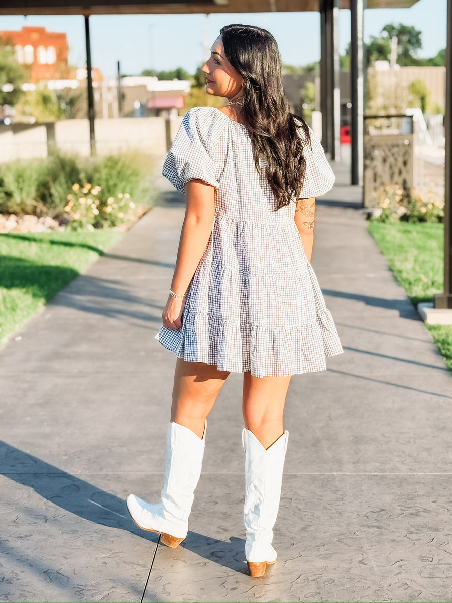 Black and white plaid tiered puff short sleeve mini dress.