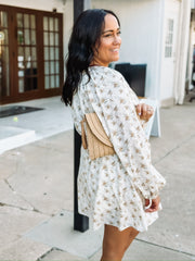Yellow floral on a cream base long sleeve  tie waist long sleeve mini dress.